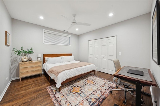 bedroom with ceiling fan, dark hardwood / wood-style flooring, and a closet