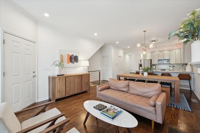 living room featuring hardwood / wood-style flooring and ornamental molding