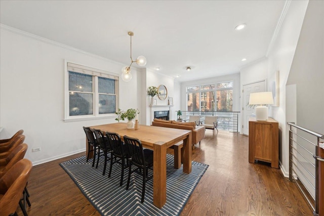 dining area featuring crown molding and dark hardwood / wood-style floors