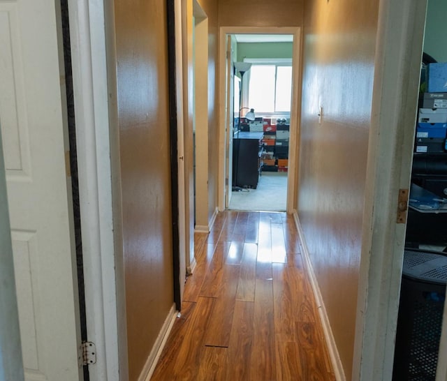 corridor with light wood-type flooring