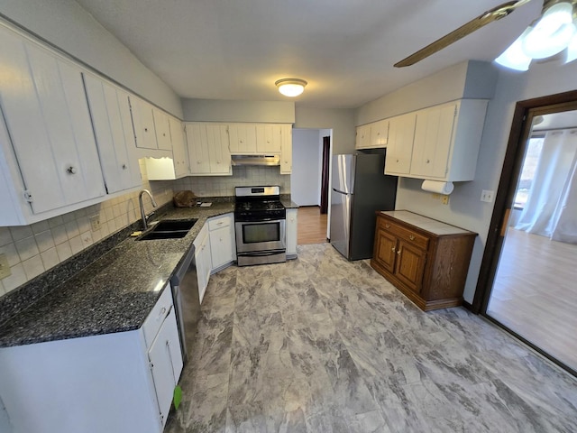 kitchen with stainless steel appliances, sink, and white cabinets