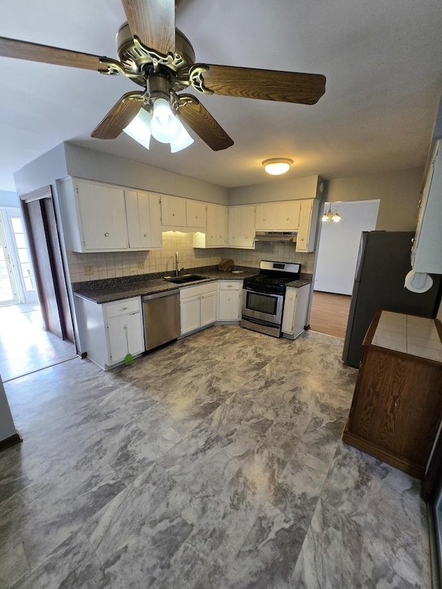 kitchen with white cabinetry, sink, decorative backsplash, and appliances with stainless steel finishes