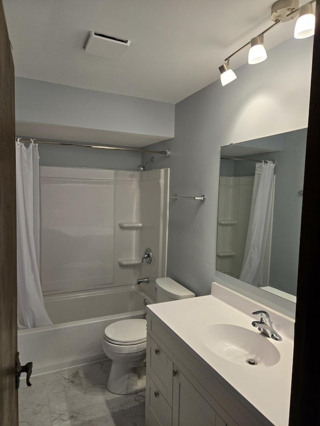 full bathroom featuring vanity, toilet, and shower / bath combo with shower curtain