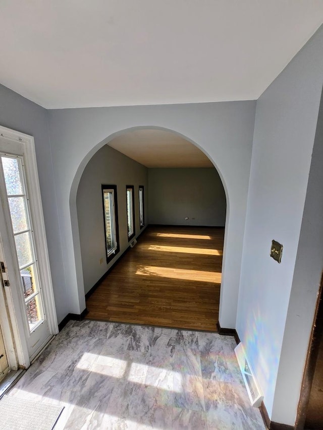 corridor with light wood-type flooring