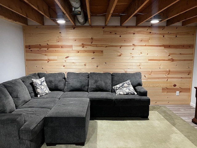 living room featuring hardwood / wood-style floors and wood walls