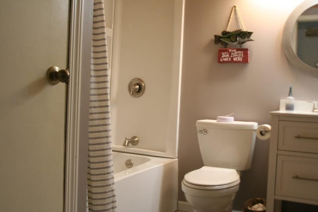 full bathroom with vanity, shower / tub combo, and toilet