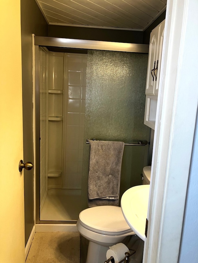 bathroom with an enclosed shower, wood ceiling, and toilet