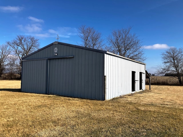 view of outbuilding with a lawn