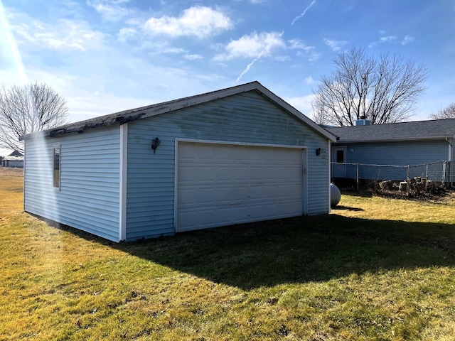 garage featuring a yard