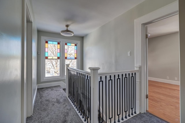 hall featuring carpet flooring