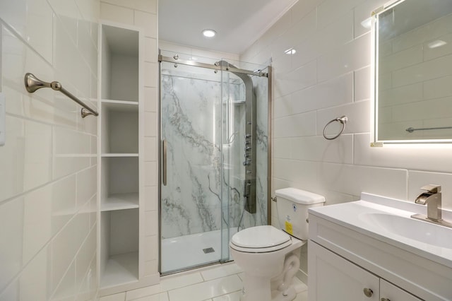 bathroom with tile walls, vanity, tasteful backsplash, toilet, and walk in shower