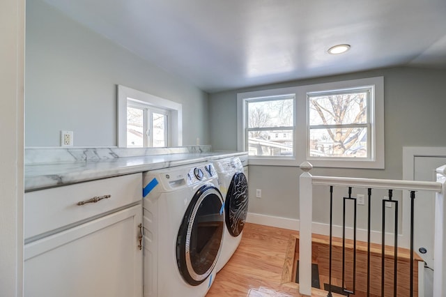 laundry room featuring light hardwood / wood-style floors and independent washer and dryer