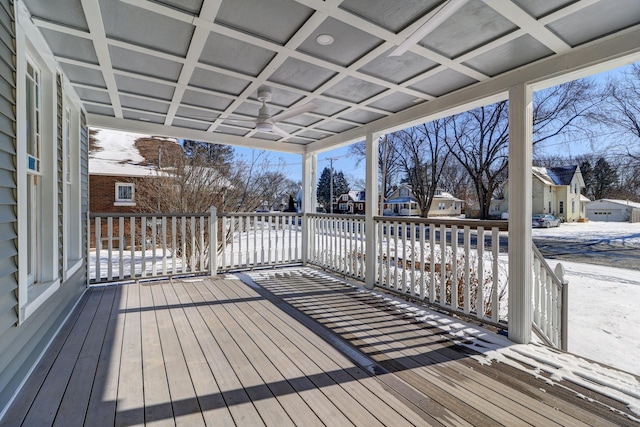 snow covered deck featuring ceiling fan