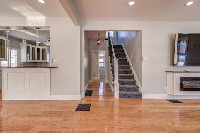 entrance foyer featuring a healthy amount of sunlight and light hardwood / wood-style floors