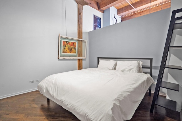 bedroom featuring wood ceiling, dark hardwood / wood-style floors, and beamed ceiling