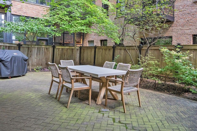 view of patio featuring a grill