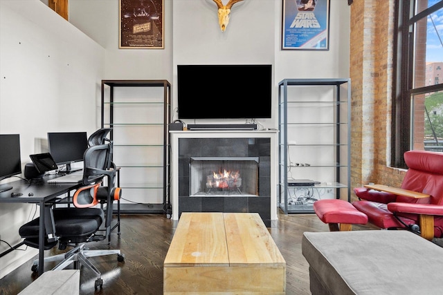 home office with dark hardwood / wood-style floors