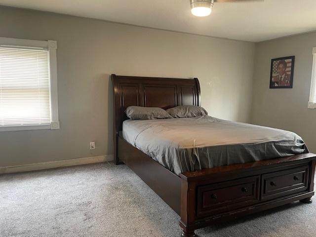 bedroom with light colored carpet