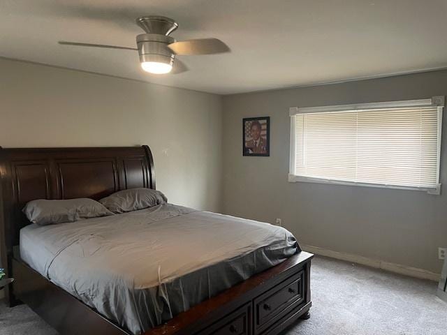 bedroom with light colored carpet and ceiling fan