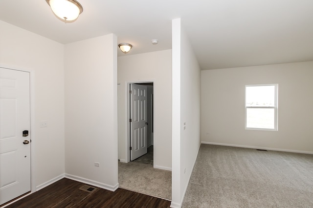 empty room with dark hardwood / wood-style floors