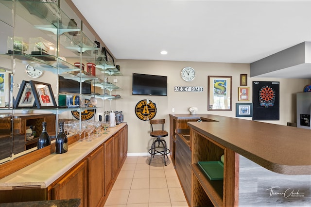 bar featuring light tile patterned floors