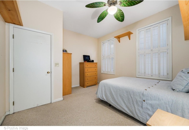 carpeted bedroom featuring ceiling fan