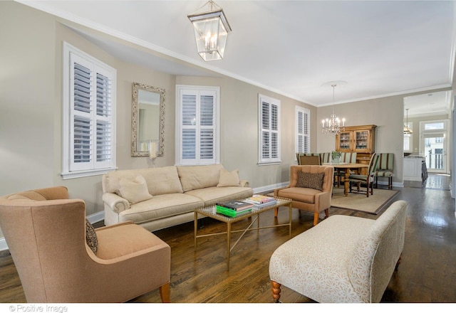 living room featuring crown molding, dark hardwood / wood-style floors, and a notable chandelier