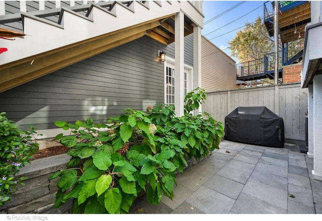 view of side of property with a patio