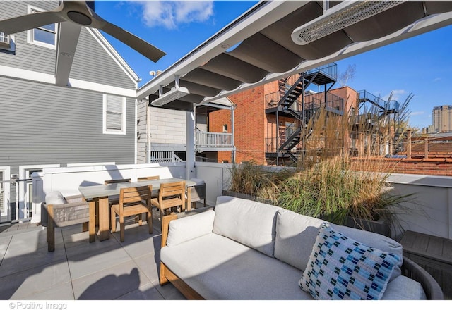 view of patio featuring an outdoor living space and ceiling fan