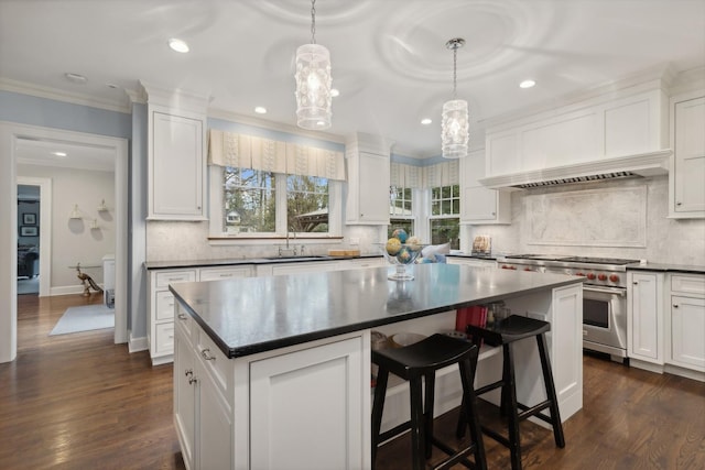 621 E Prospect Ave, Lake Bluff, IL 60044 - kitchen with designer range, dark countertops, a chandelier, white cabinetry, and a sink