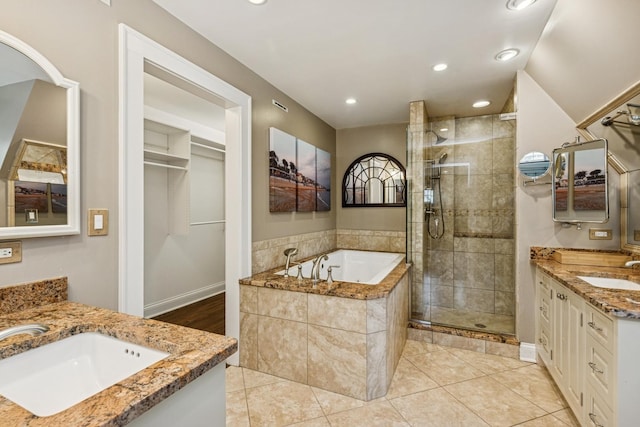 621 E Prospect Ave, Lake Bluff, IL 60044 - full bathroom with a shower stall, two vanities, a bath, recessed lighting, and tile patterned flooring
