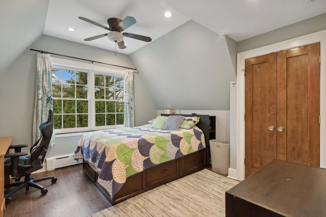 621 E Prospect Ave, Lake Bluff, IL 60044 - bedroom with lofted ceiling, a baseboard heating unit, wood finished floors, recessed lighting, and a desk