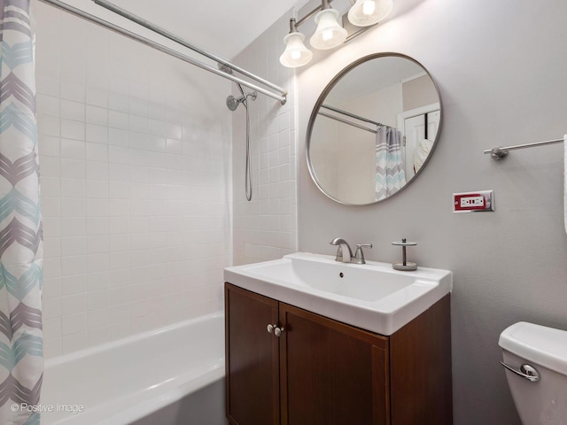 full bathroom featuring vanity, shower / tub combo with curtain, and toilet