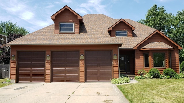 view of front facade featuring a garage and a front lawn