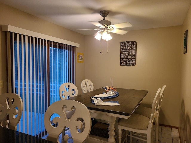 tiled dining area with ceiling fan