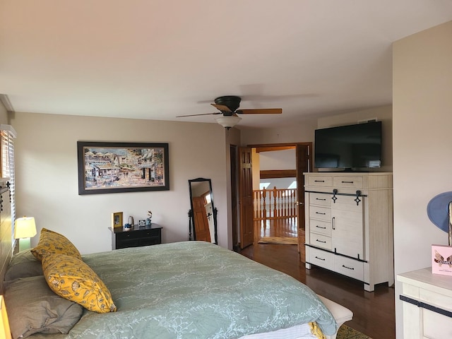 bedroom featuring dark hardwood / wood-style flooring and ceiling fan