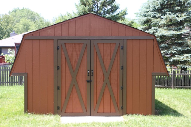 view of outbuilding with a lawn