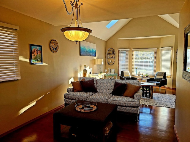 living room with lofted ceiling with skylight and dark hardwood / wood-style floors