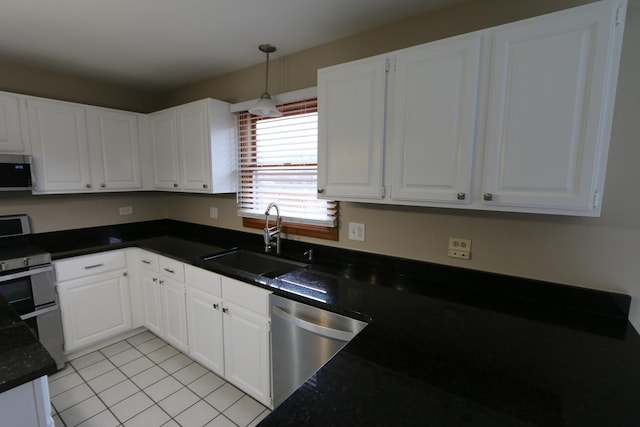 kitchen featuring sink, white cabinets, and appliances with stainless steel finishes