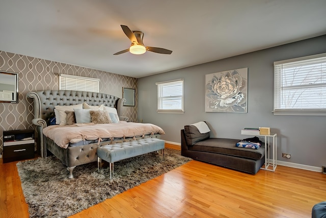 bedroom with wood-type flooring and ceiling fan