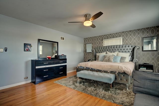 bedroom with hardwood / wood-style flooring and ceiling fan