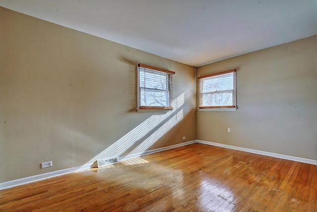 spare room with light hardwood / wood-style flooring