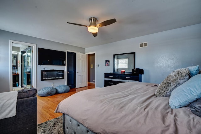 bedroom featuring ceiling fan and wood-type flooring