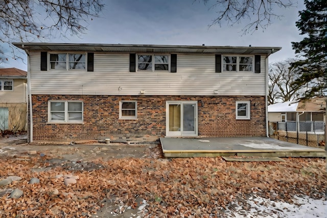 rear view of property featuring a patio