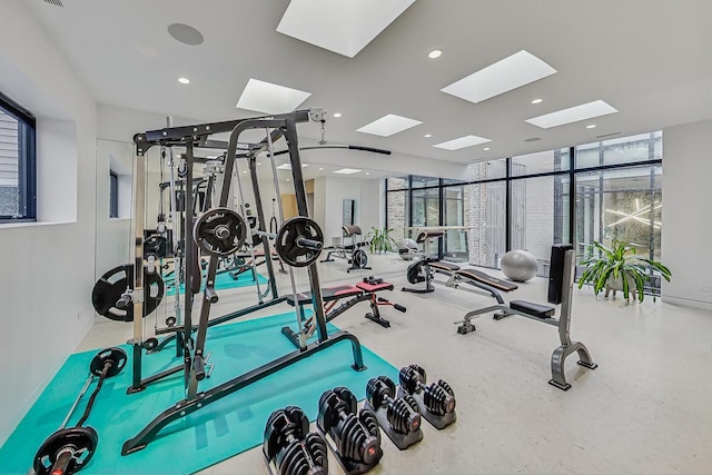 workout area featuring a wealth of natural light, floor to ceiling windows, and recessed lighting