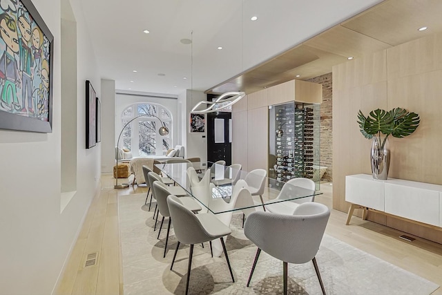 dining area with recessed lighting, visible vents, and light wood finished floors