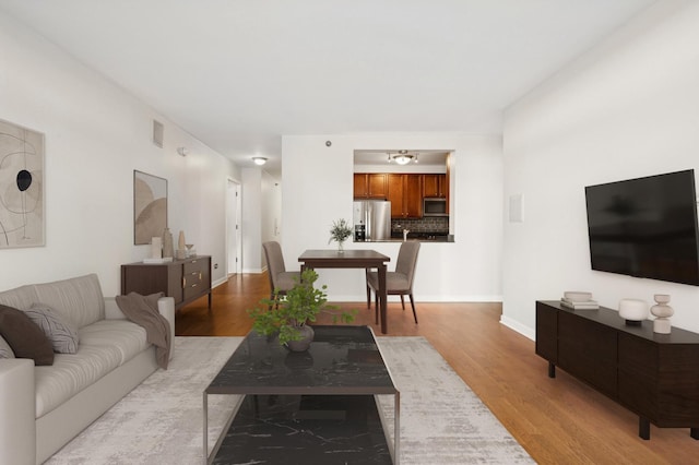 living room with light hardwood / wood-style floors