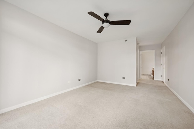 empty room featuring light carpet and ceiling fan