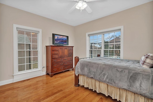 bedroom featuring wood-type flooring and ceiling fan