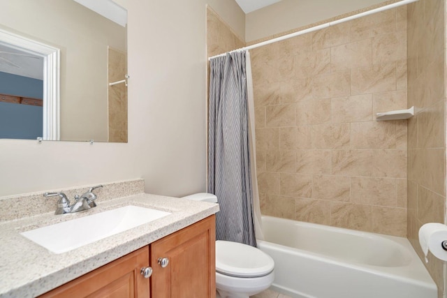 full bathroom with vanity, shower / tub combo, and toilet